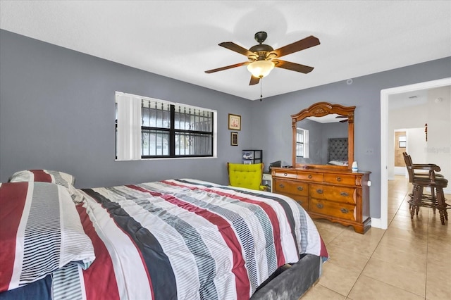 bedroom featuring ceiling fan and light tile patterned floors