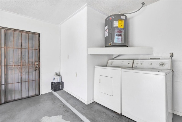 washroom featuring washer and clothes dryer, water heater, and a textured ceiling