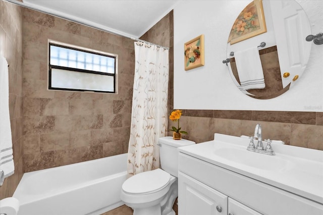 full bathroom with shower / bath combo, tile walls, vanity, and toilet