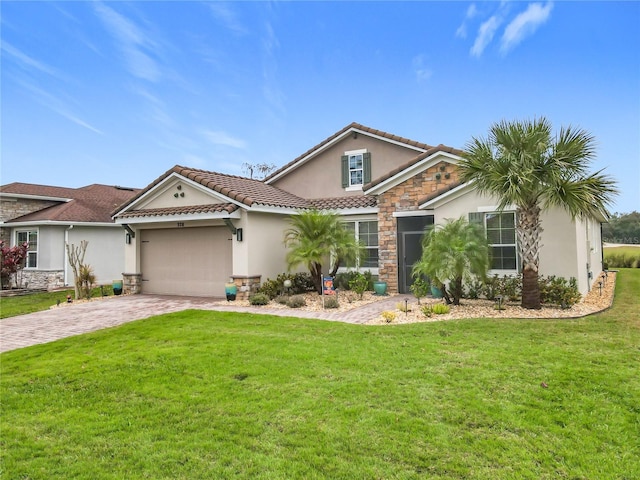 view of front of house with a garage and a front lawn