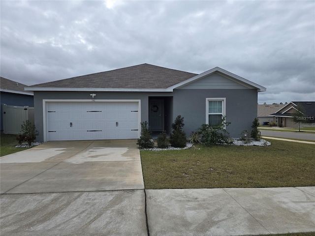 ranch-style home with a garage and a front yard