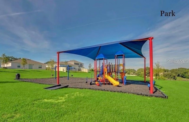 view of jungle gym featuring a lawn