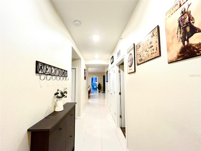 hallway with light tile patterned floors