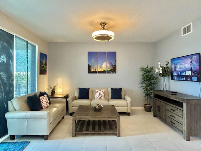 living room featuring light tile patterned flooring