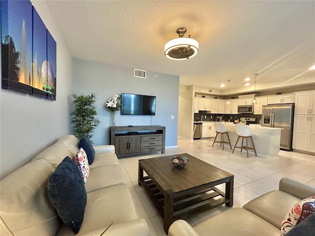 living room featuring light tile patterned floors