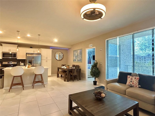 tiled living room with plenty of natural light