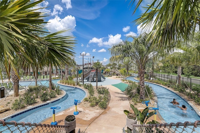 view of pool featuring a playground