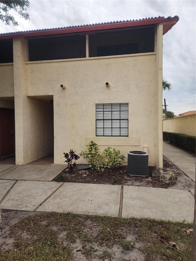 doorway to property with cooling unit