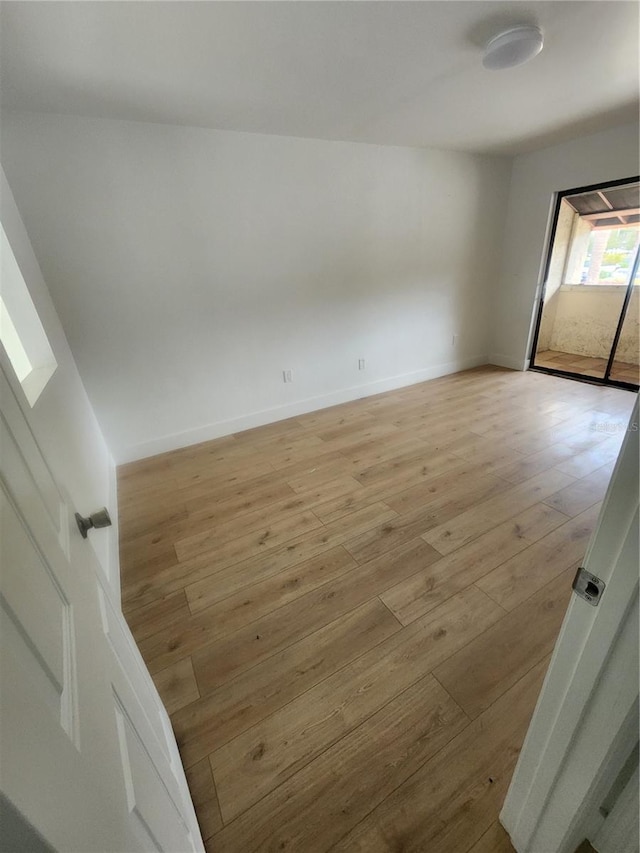 unfurnished room with light hardwood / wood-style floors