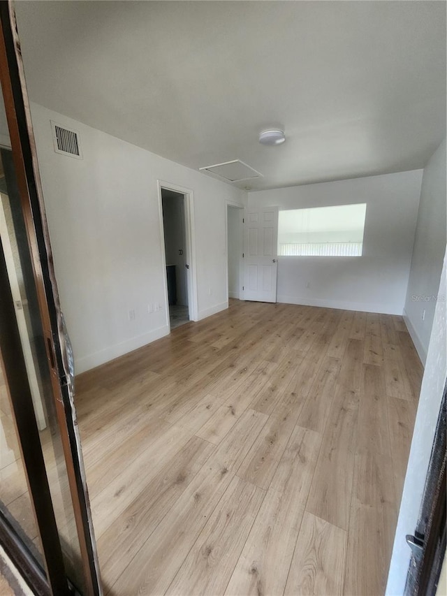 spare room featuring light wood-type flooring