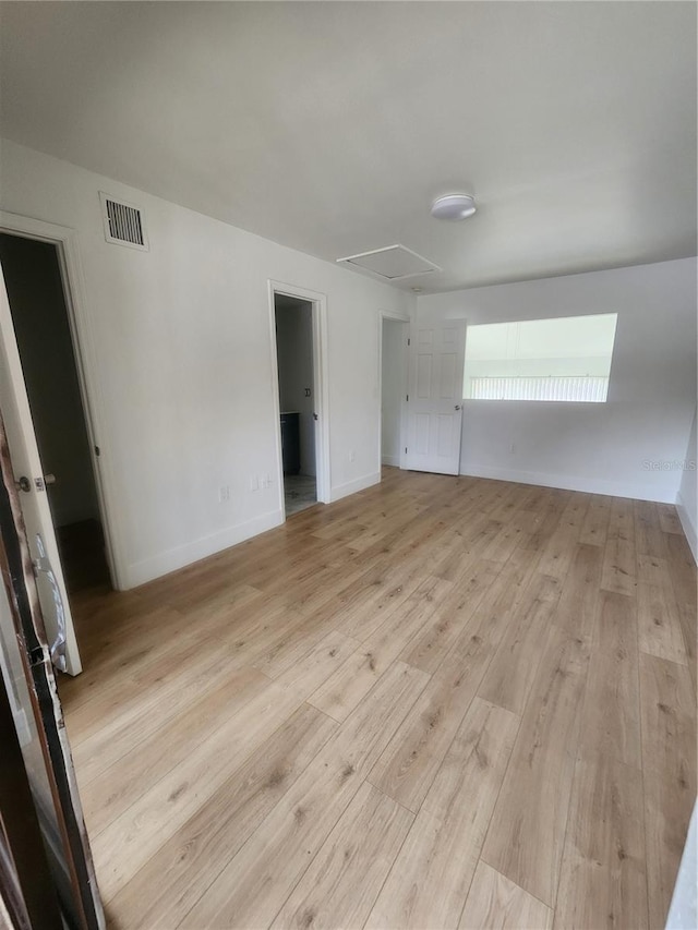 unfurnished room featuring light hardwood / wood-style floors