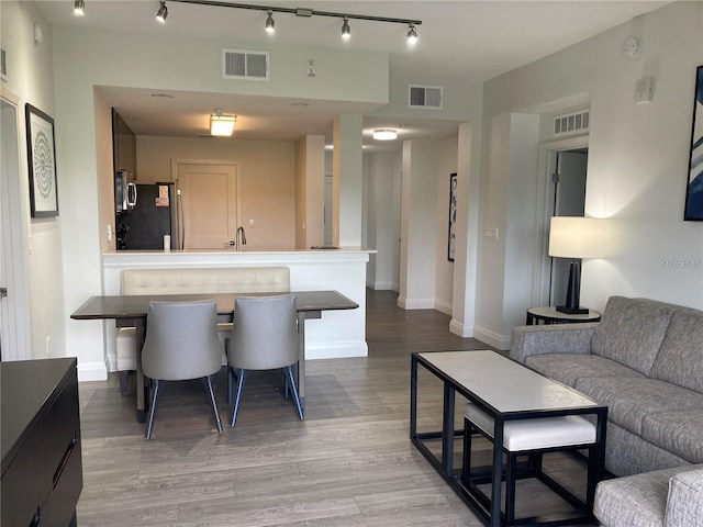 living room with light hardwood / wood-style flooring