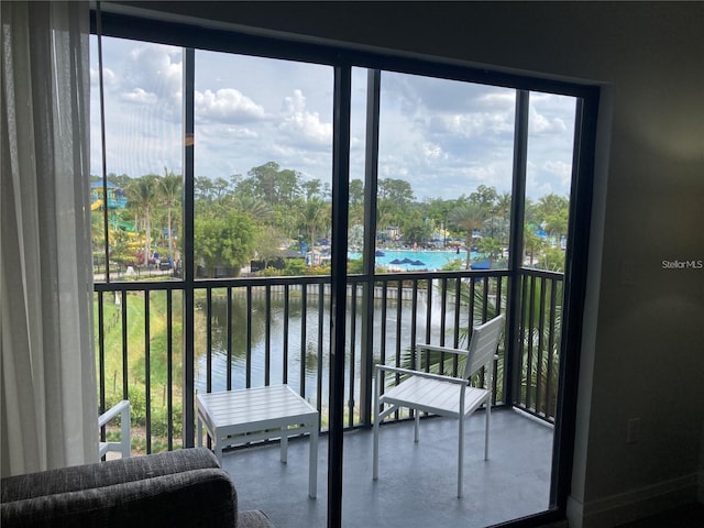 sunroom with a water view