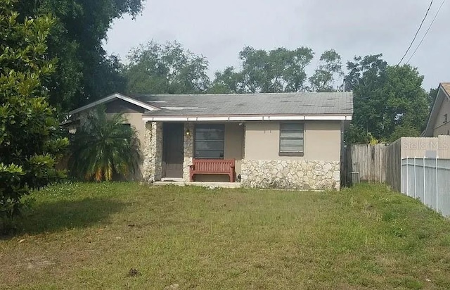 back of house featuring a yard