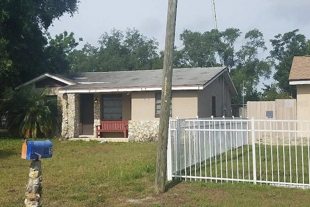 view of side of home with a lawn