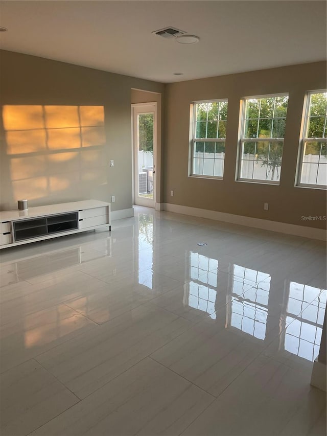 empty room with light tile patterned floors