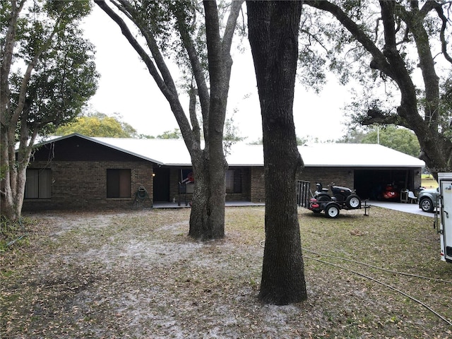 ranch-style house with a carport