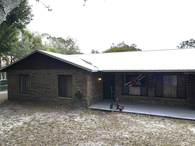 back of property featuring a patio area