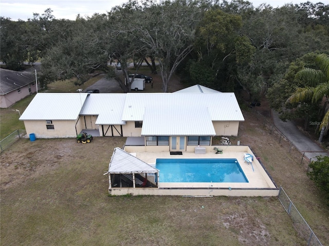 view of pool with a lawn