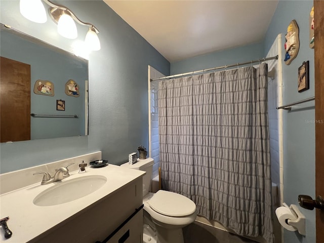 full bathroom featuring shower / bathtub combination with curtain, vanity, and toilet