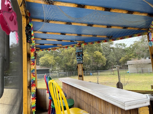 view of jungle gym with a bar and a lawn