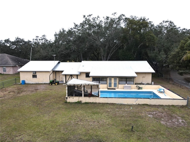 view of swimming pool with a gazebo and a yard