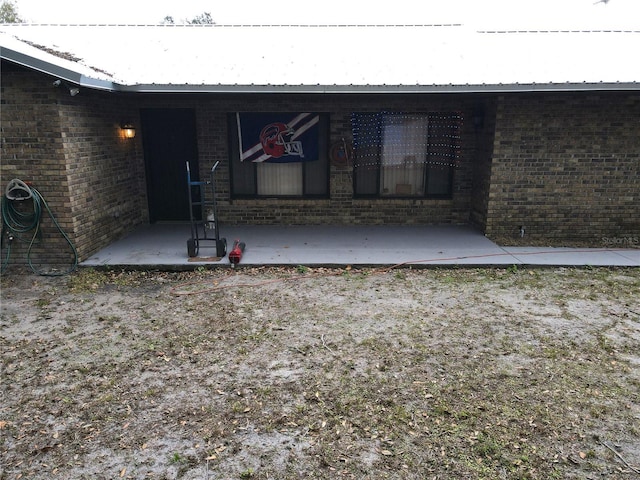 rear view of property featuring a patio