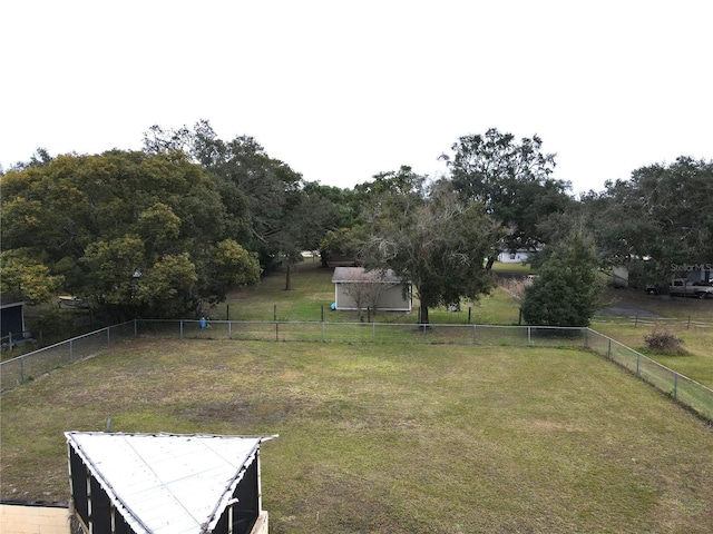 view of yard with a rural view and an outdoor structure