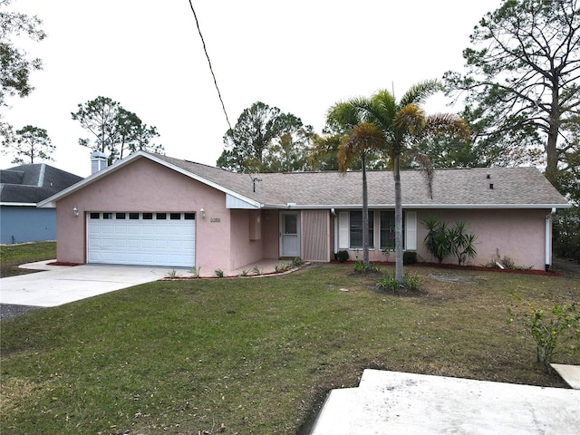 ranch-style home with a garage and a front lawn