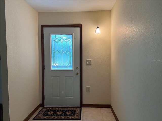 entryway featuring light tile patterned flooring