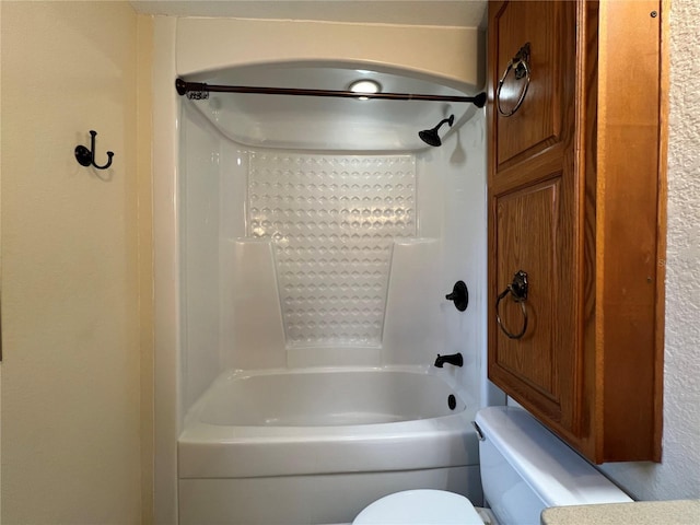 bathroom featuring toilet and shower / bathing tub combination