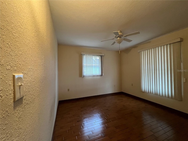 spare room with a textured ceiling and ceiling fan