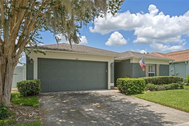 ranch-style home featuring a garage