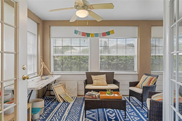 sunroom / solarium with ceiling fan