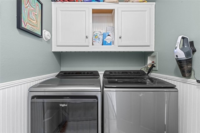 laundry area with cabinets and washing machine and dryer