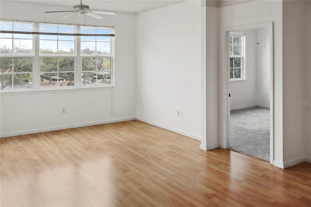 spare room featuring ceiling fan and light hardwood / wood-style floors