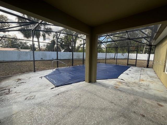 view of patio with a lanai