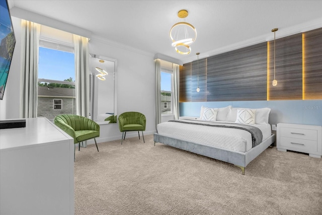 carpeted bedroom featuring a notable chandelier, crown molding, and multiple windows