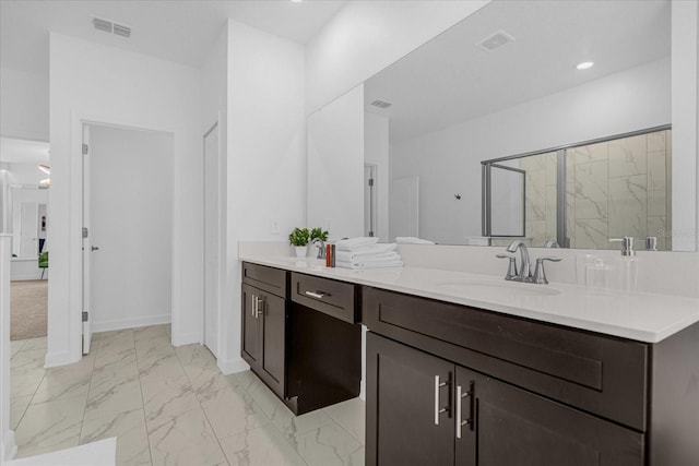 bathroom with vanity and an enclosed shower