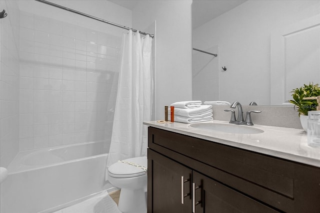 full bathroom featuring toilet, vanity, and shower / tub combo with curtain