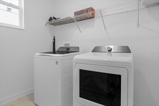 clothes washing area featuring washing machine and clothes dryer