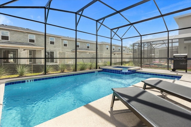 view of pool featuring a lanai, a patio area, grilling area, and an in ground hot tub