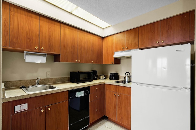 kitchen featuring a textured ceiling, light tile patterned flooring, sink, and black appliances