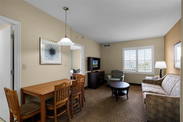 view of carpeted dining area