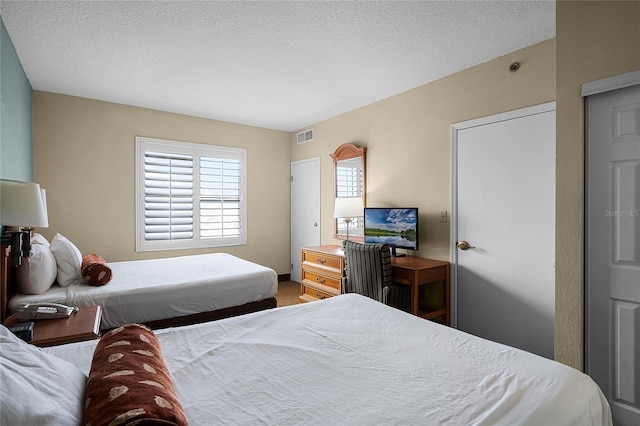 bedroom featuring a textured ceiling