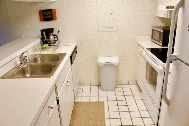 kitchen with sink, white appliances, and light tile patterned floors