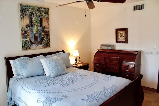 bedroom with ceiling fan and carpet