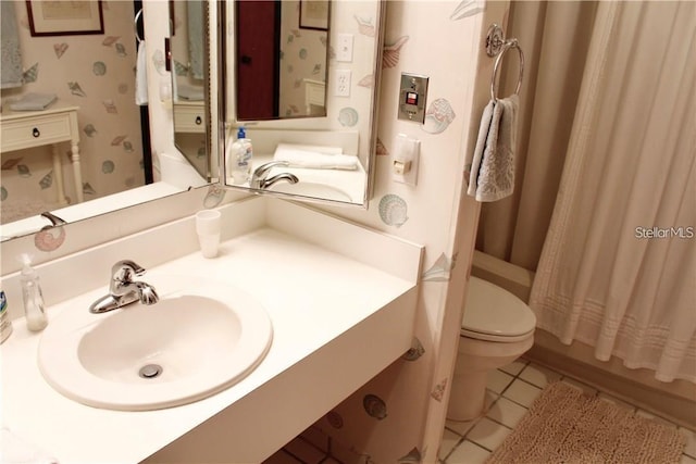 full bathroom with toilet, tile patterned flooring, shower / tub combo, and sink