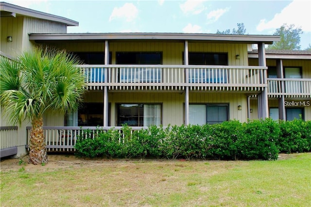 rear view of house with a lawn