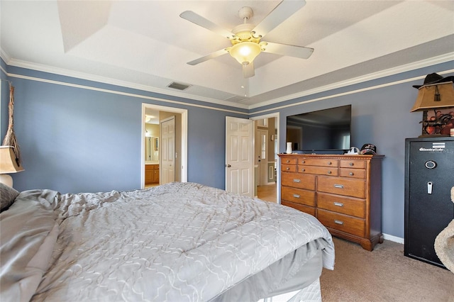 bedroom with ceiling fan, a raised ceiling, ensuite bath, ornamental molding, and light carpet